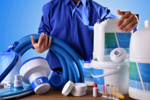 Swimming pool maintenance worker with blue background