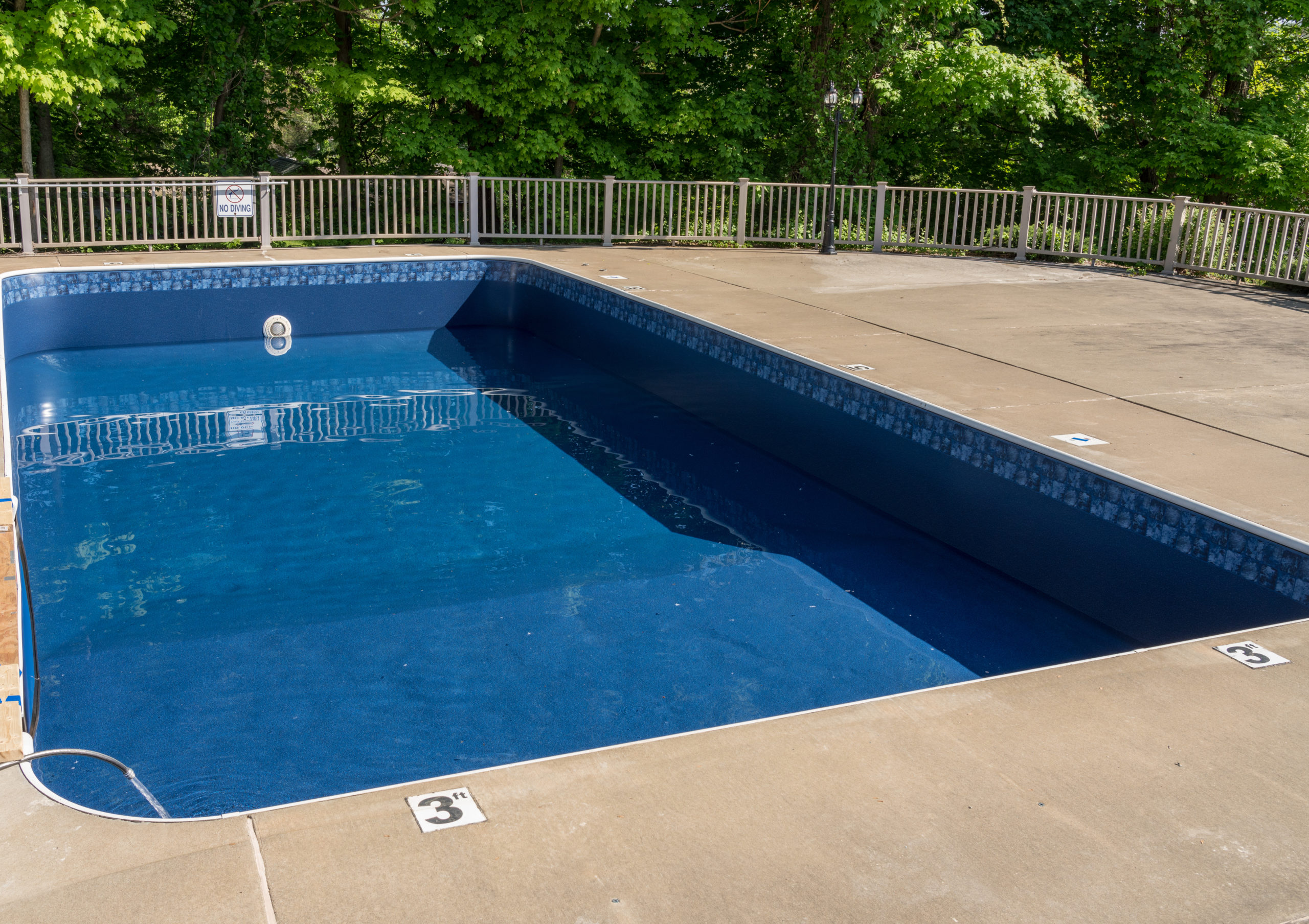 The vinyl surface of a pool, known for its durability and smooth texture.