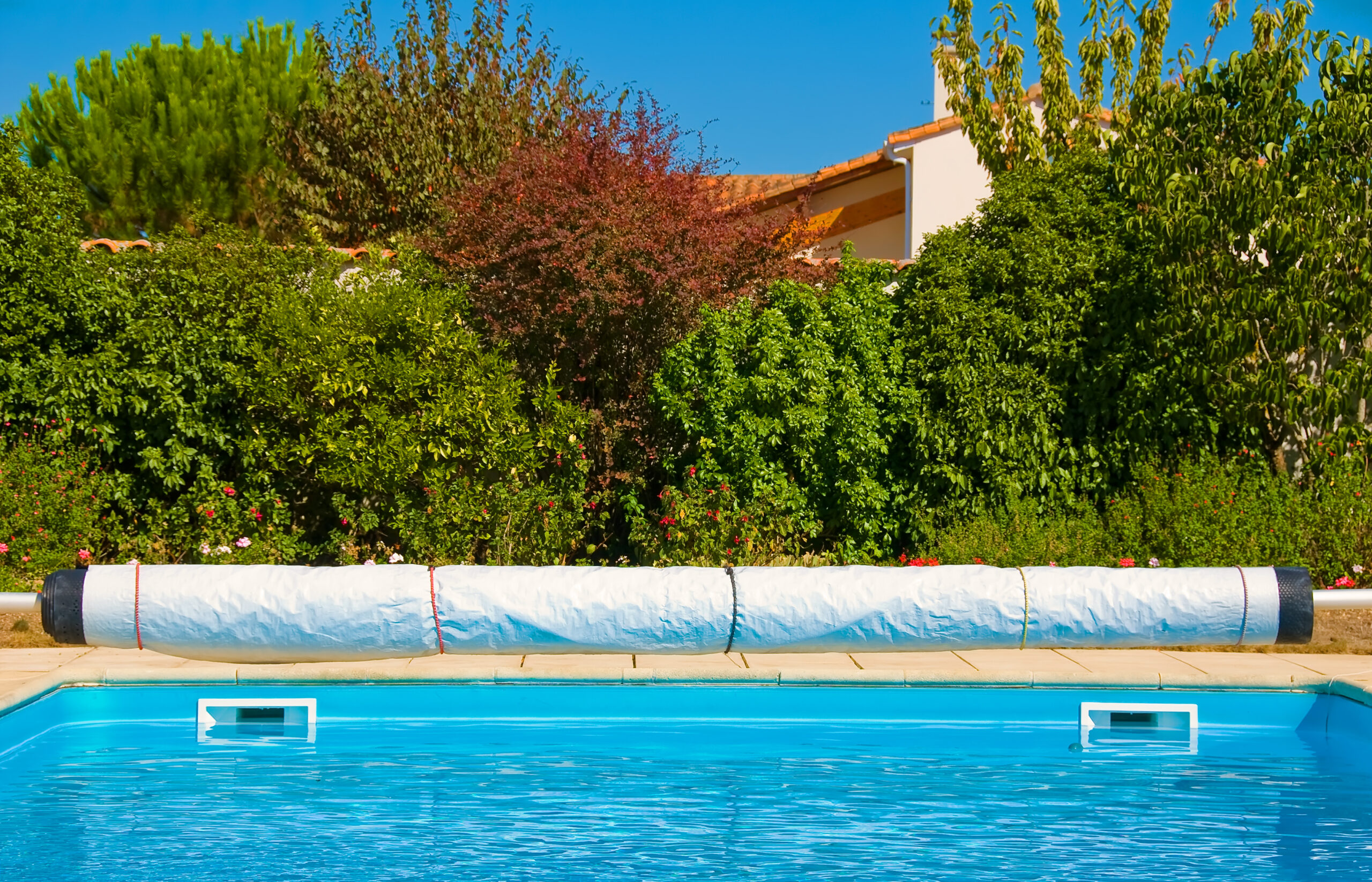 A pool cover securely placed over a swimming pool, providing protection and safety during periods of non-use.