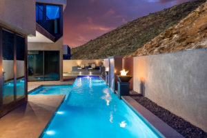 A pool illuminated at night with mesmerizing lighting, casting a magical and inviting glow.